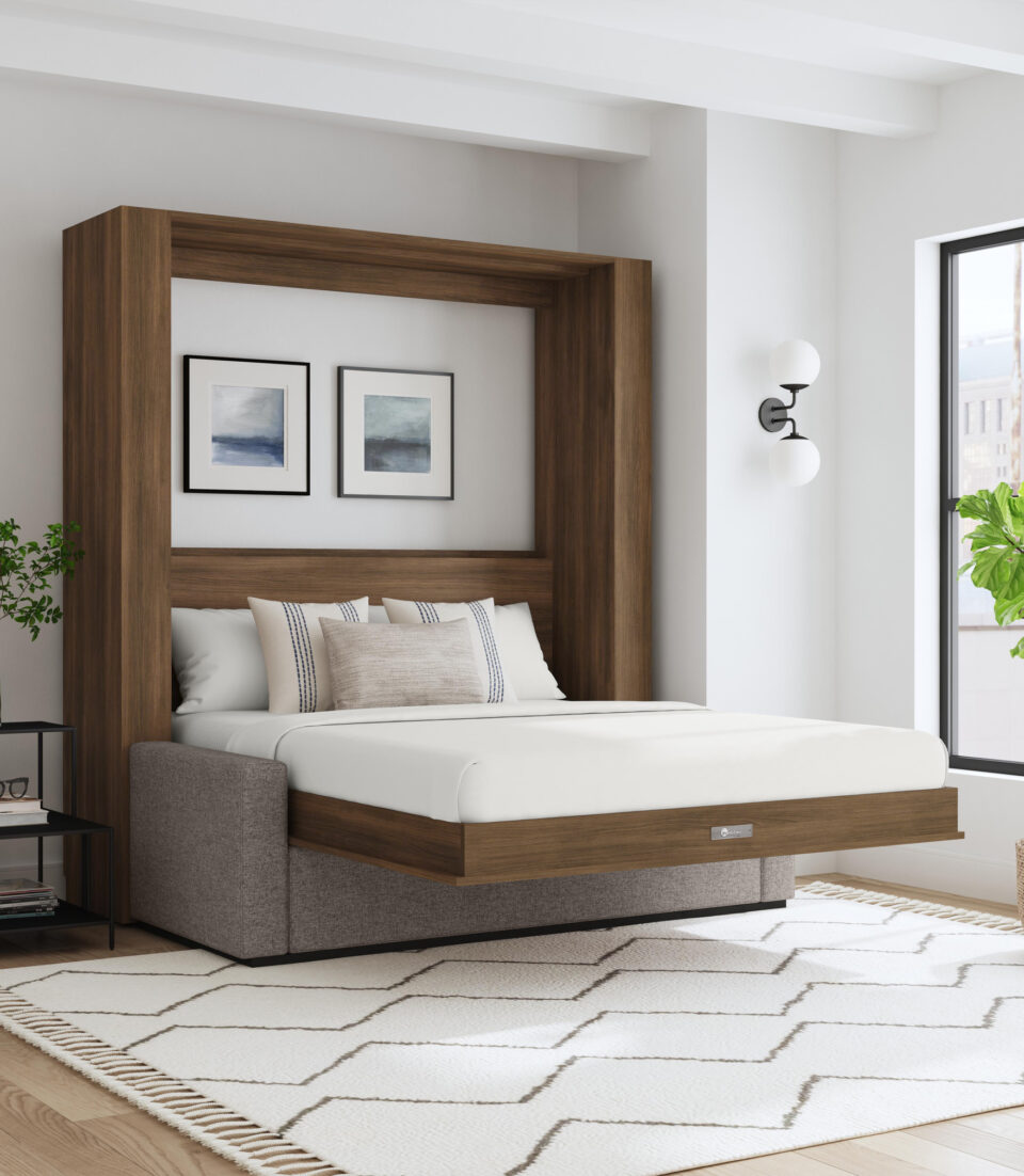 Murphy bed pulled down in a living room with wooden cabinet around it